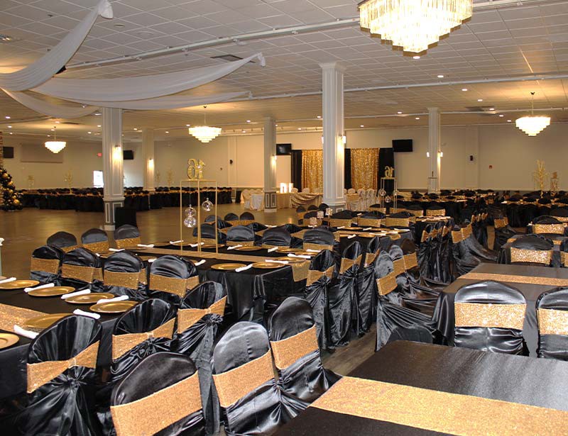 Garcia Event Centers san antonio event venue decorated setup for parties with chandeliers and ceiling fabric