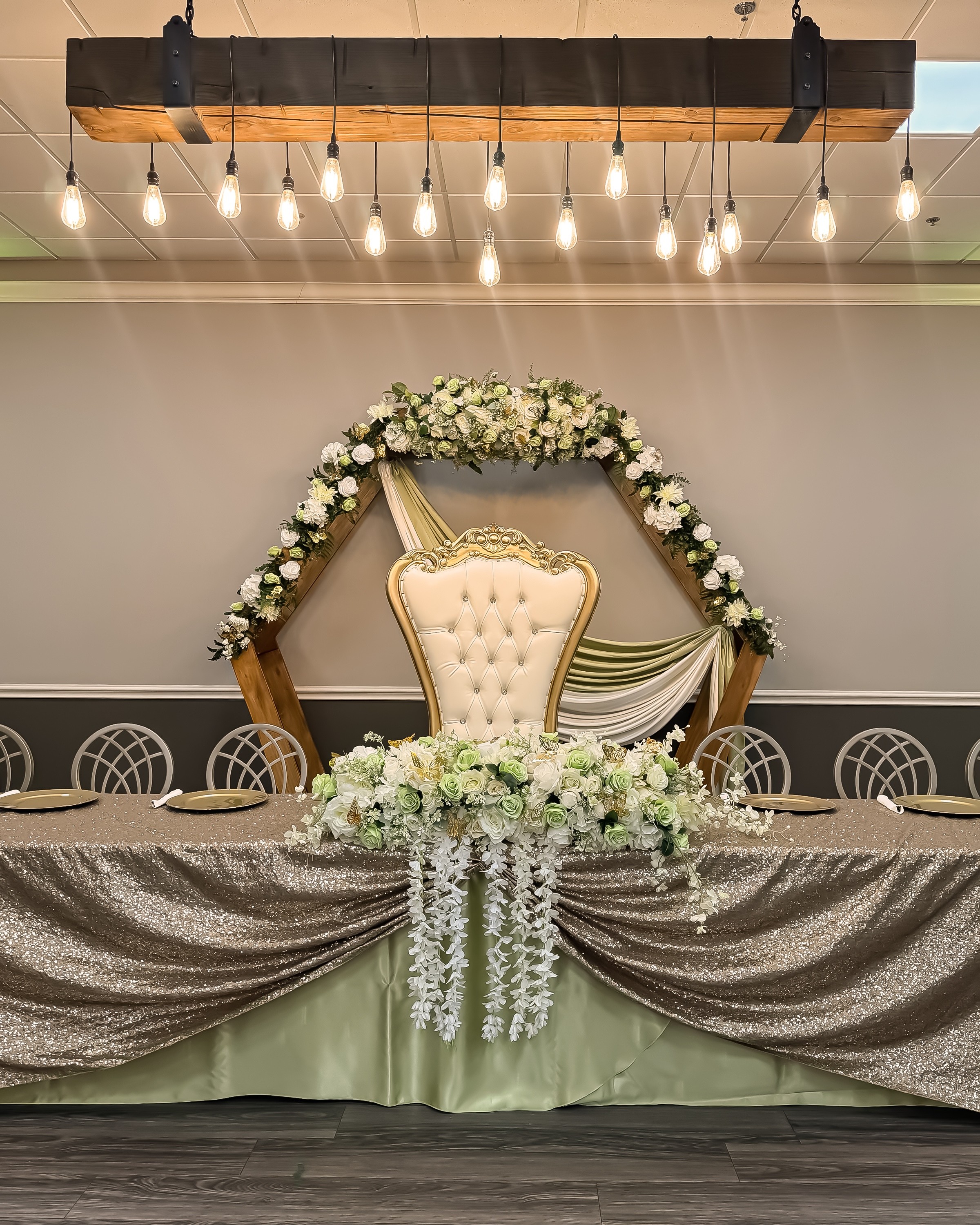 Garcia Event Centers in San Antonio for parties with tables in foreground and projector screen in background