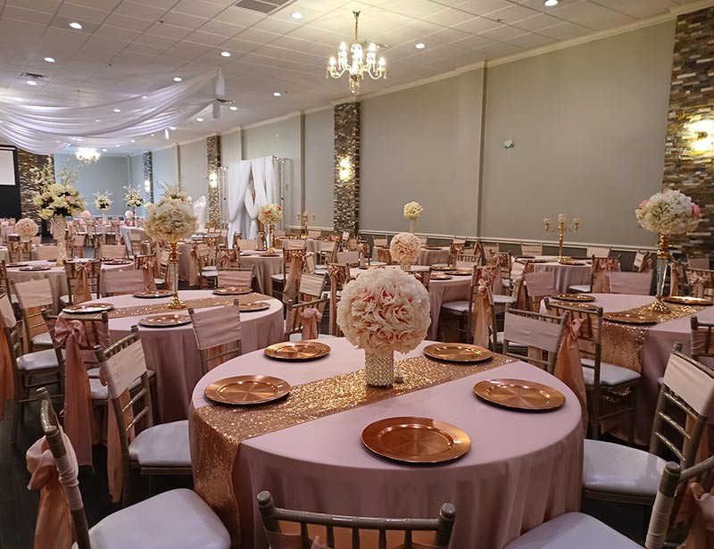 Garcia Event Centers event venue for rent with wall stonework and table decor setup
