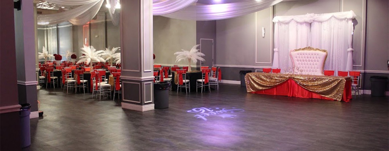 Crown Jewel Ballroom in San Antonio decorated with a red and gold main table