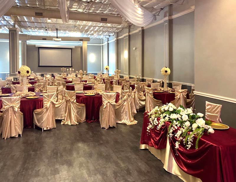 crown jewel ballroom party hall setup with projector screen