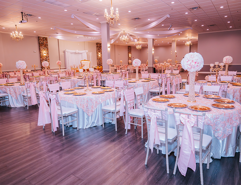 Quinceañera head table with sparkly backdrop