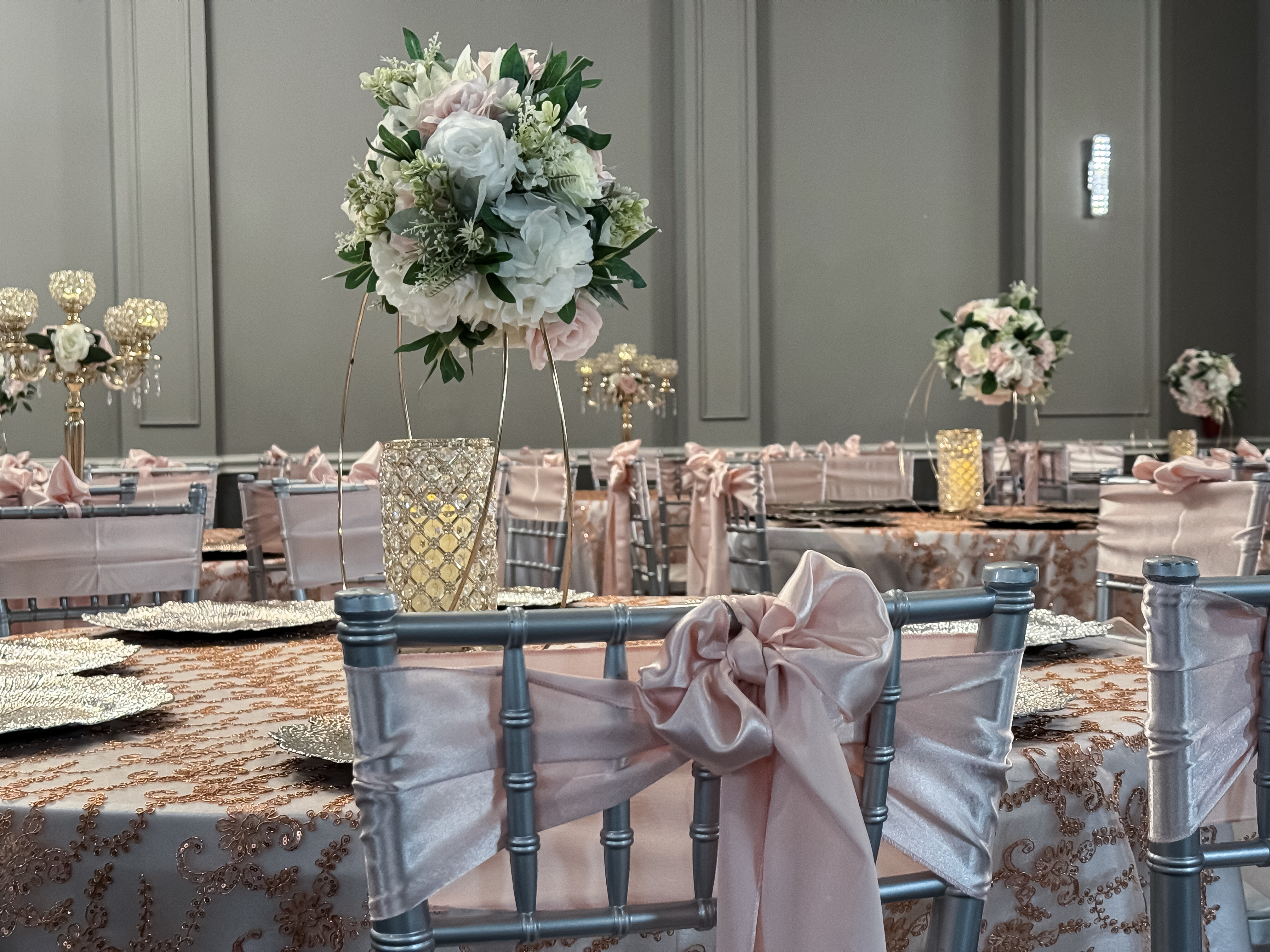 Party Hall San Antonio Light Pink table centerpiece with pink and while floral.